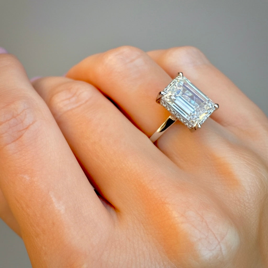 Emerald-cut lab-grown diamond ring, top view of the clean solitaire silhouette