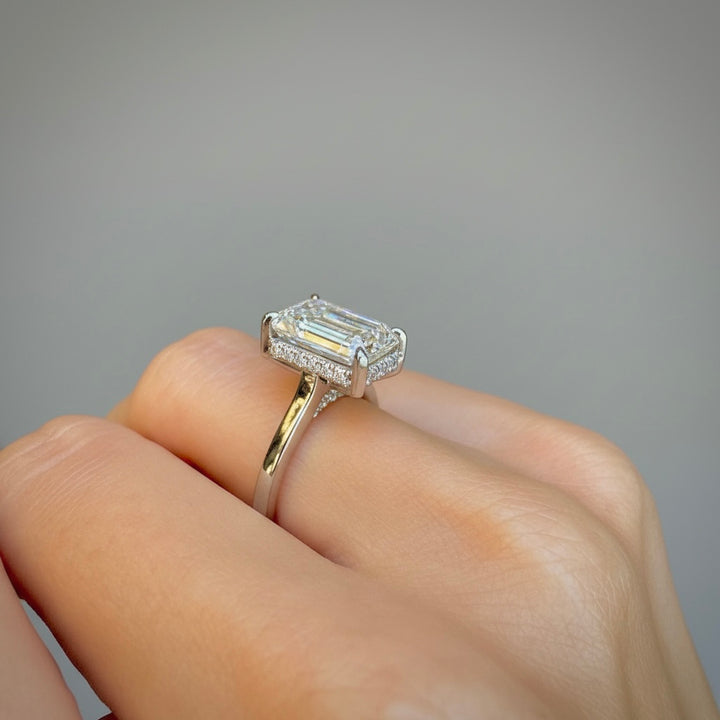 Profile of the emerald-cut lab-grown diamond ring showing the hidden halo beneath the center stone