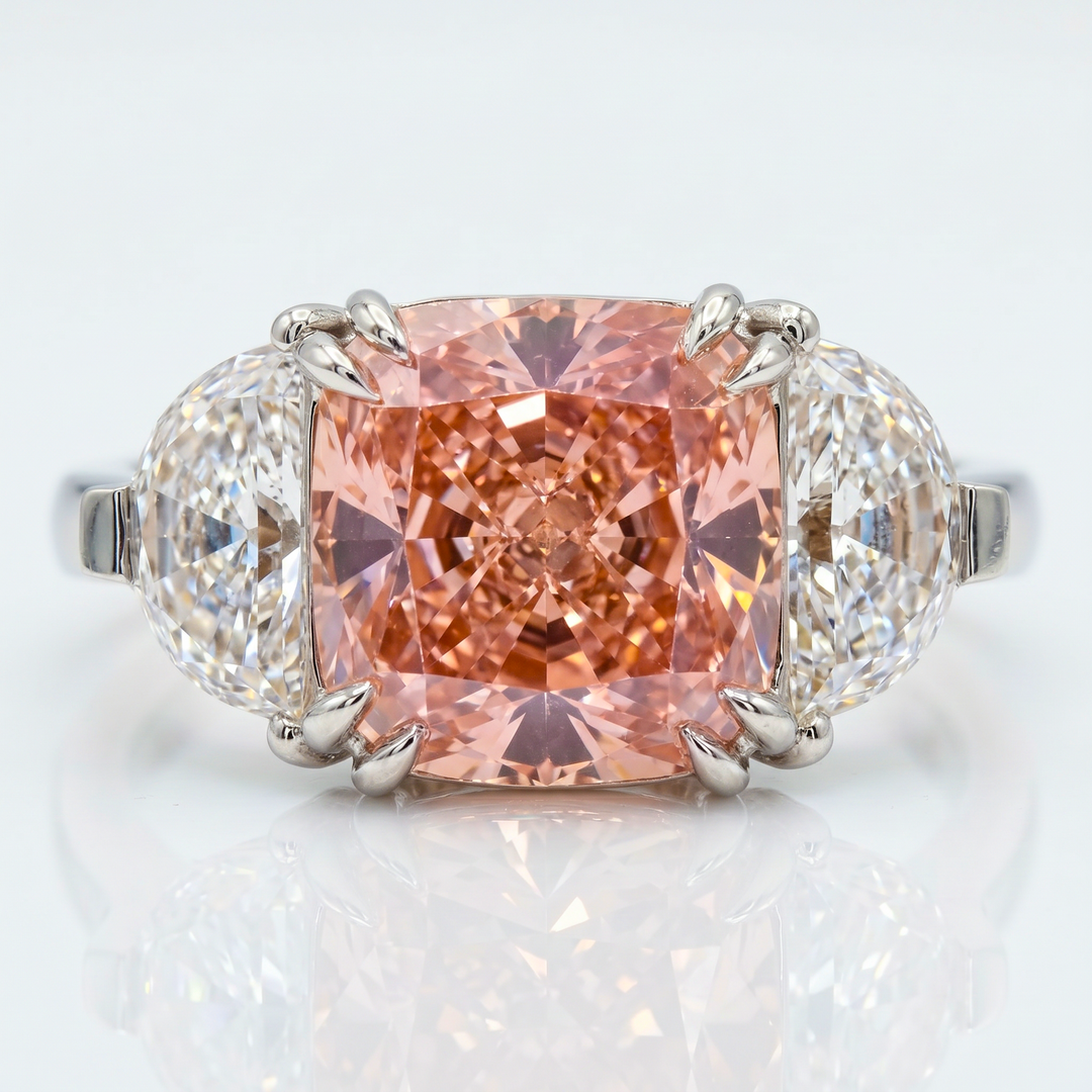 Azuri three-stone ring with cushion-cut Fancy Vivid Pink lab-grown diamond and half-moon side stones in 14K white gold — studio view