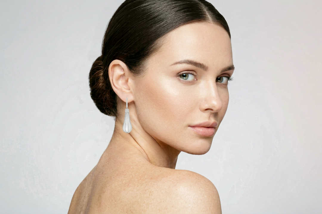Model wearing the carved rock crystal and lab-grown diamond pavé drop earrings