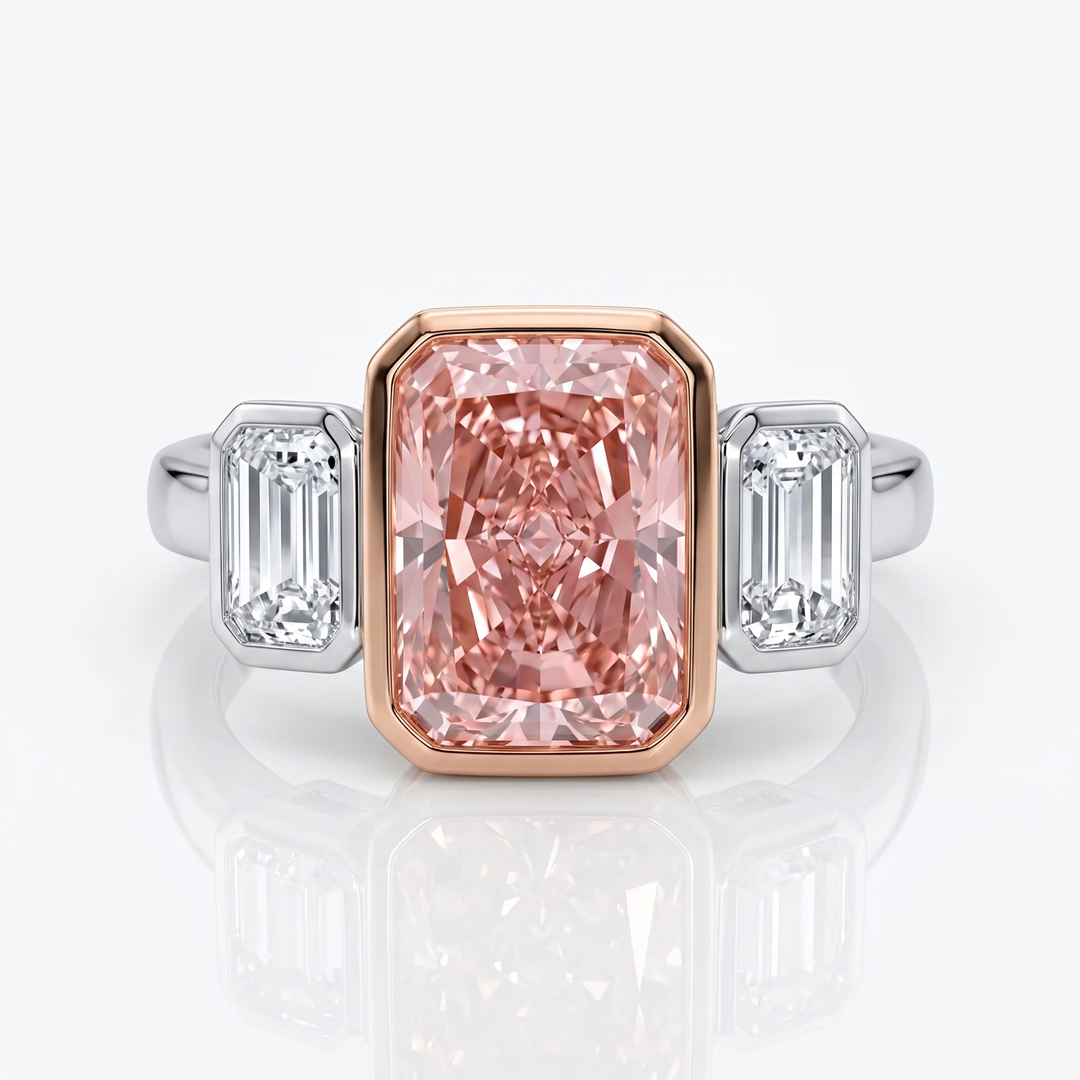 Azuri three-stone ring with radiant-cut Fancy Vivid Pink lab-grown diamond in 18K rose gold bezel and baguette side stones in white gold — studio view