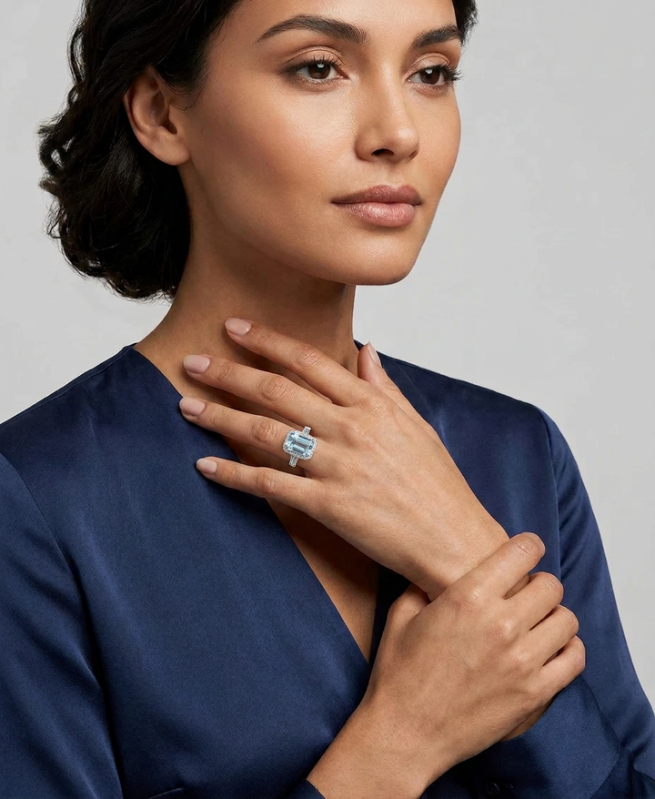 Model wearing the fancy blue emerald-cut lab-grown diamond halo ring