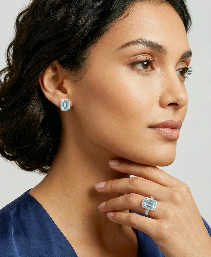 Model wearing the fancy blue emerald-cut lab-grown diamond halo stud earrings