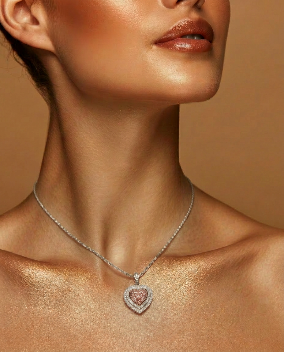 Model wearing the Fancy Vivid Pink heart-shape lab-grown diamond pendant on a fine chain
