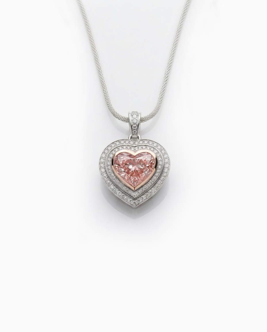 Fancy Vivid Pink heart-shape lab-grown diamond pendant with 14K rose gold bezel and double diamond pavé heart frame in white gold — studio view