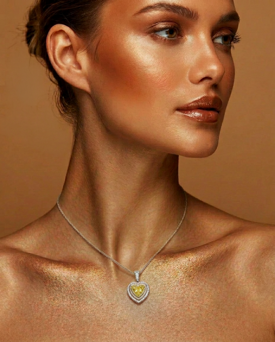 Model wearing the 2 ct Fancy Vivid Yellow heart-shape lab-grown diamond double halo pendant
