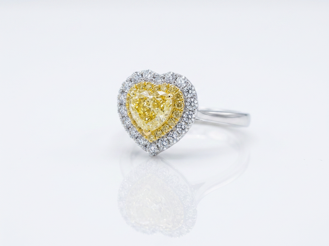 Fancy Vivid Yellow heart-shape lab-grown diamond ring with two-tone double pavé halo in 14K white gold — studio view