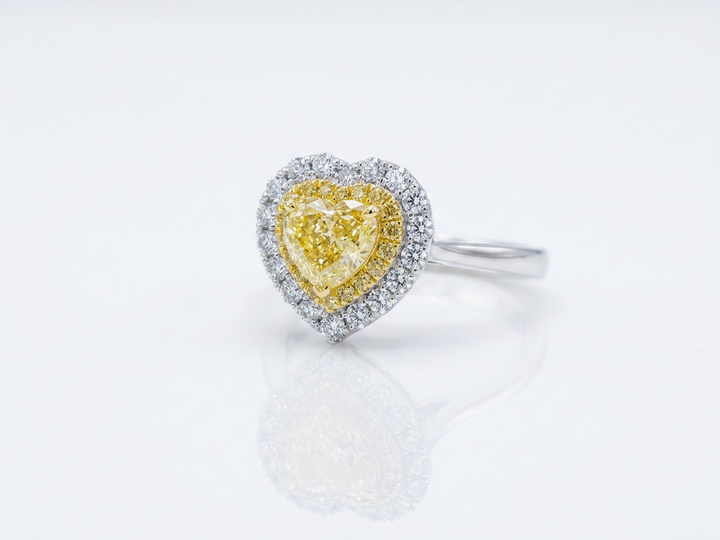 Fancy Vivid Yellow heart-shape lab-grown diamond ring with two-tone double pavé halo in 14K white gold — studio view