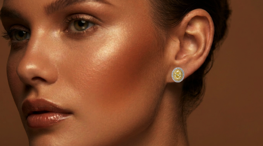 Model wearing the Fancy Vivid Yellow oval lab-grown diamond double halo stud earring