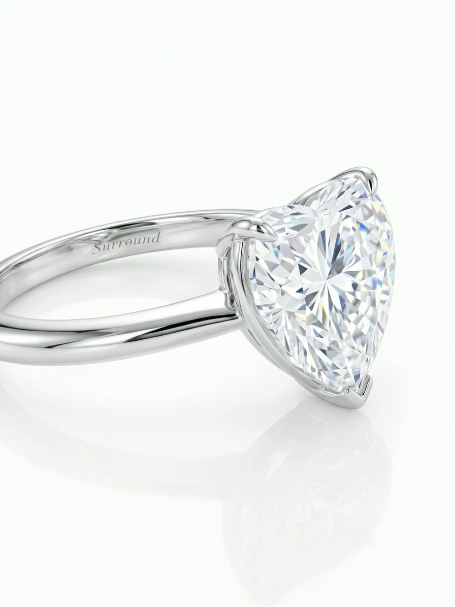 5.07 ct heart-shaped lab-grown diamond solitaire ring in 18K white gold with Surround engraving