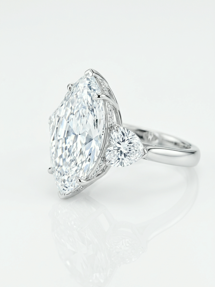 10.07 ct marquise lab-grown diamond three-stone ring with heart side stones in 18K white gold
