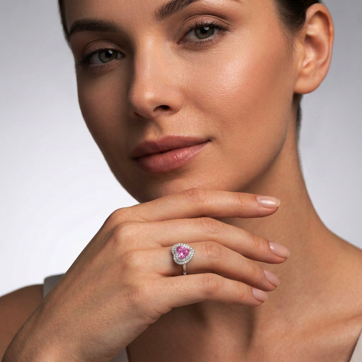 Model wearing the 1 ct pink lab-grown sapphire heart double halo ring