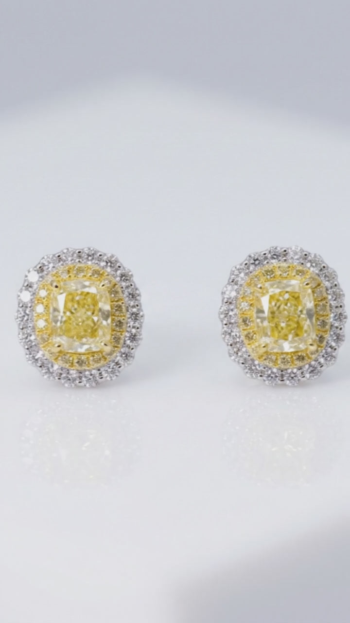 Video of the Fancy Vivid Yellow cushion-cut lab-grown diamond double halo stud earrings