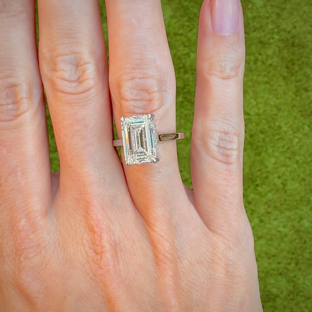 Video of the 5 ct emerald-cut lab-grown diamond hidden halo ring in 14K white gold