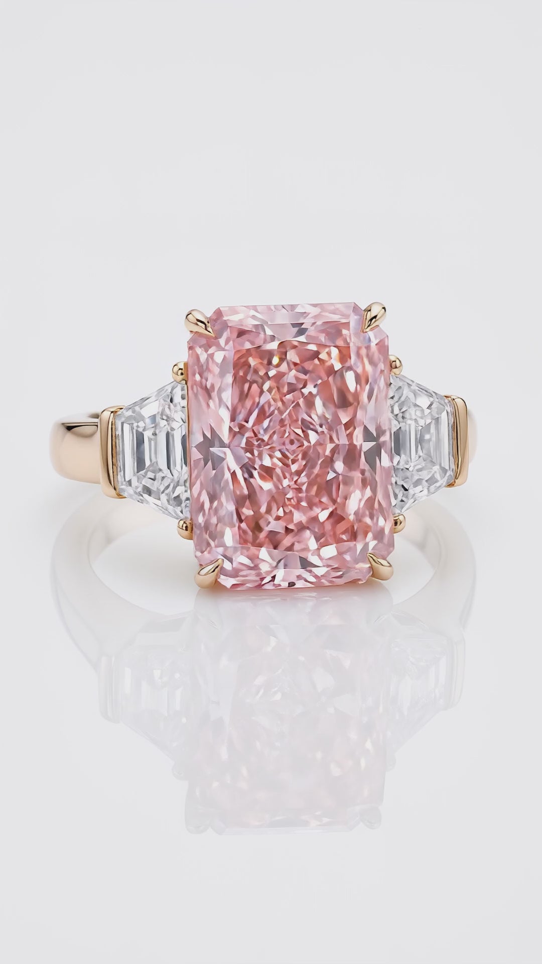 Video of the 7.5 ct Fancy Vivid Pink radiant-cut lab-grown diamond three-stone ring