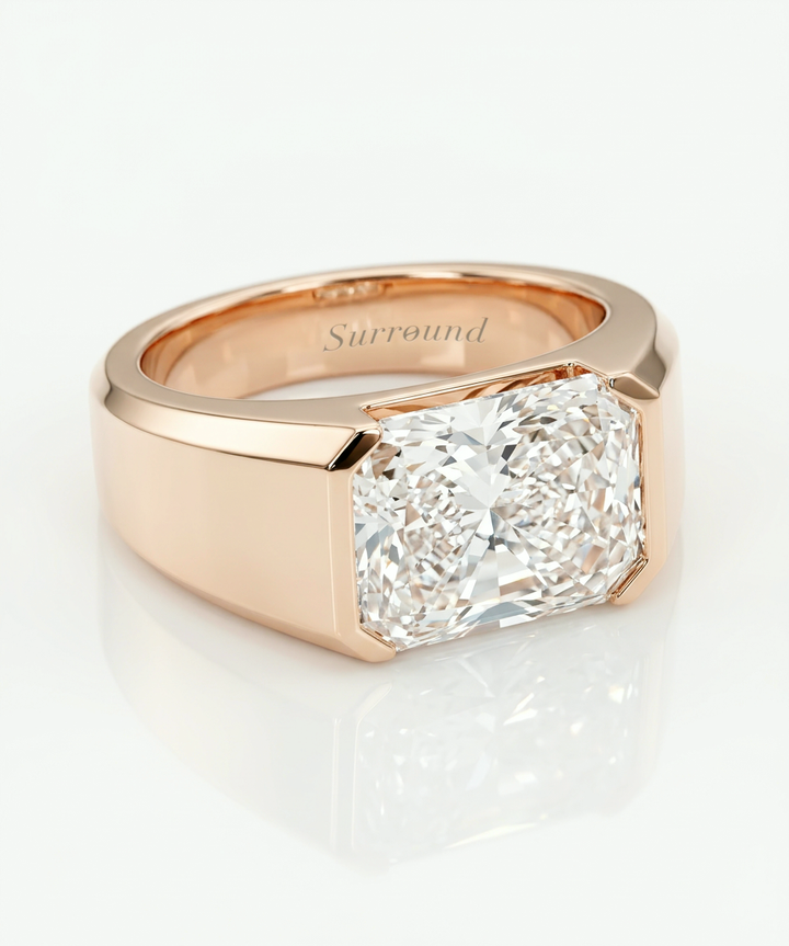 Unisex east-west radiant-cut lab-grown diamond bezel ring, estimated 5.5 ct, in rose gold with Surround engraving
