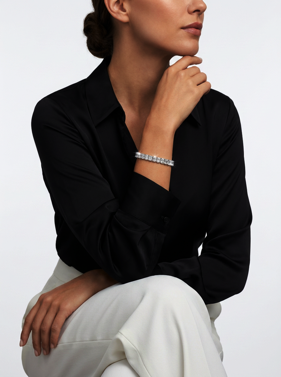Model wearing the 22 ct radiant-cut lab-grown diamond tennis bracelet in 14K white gold